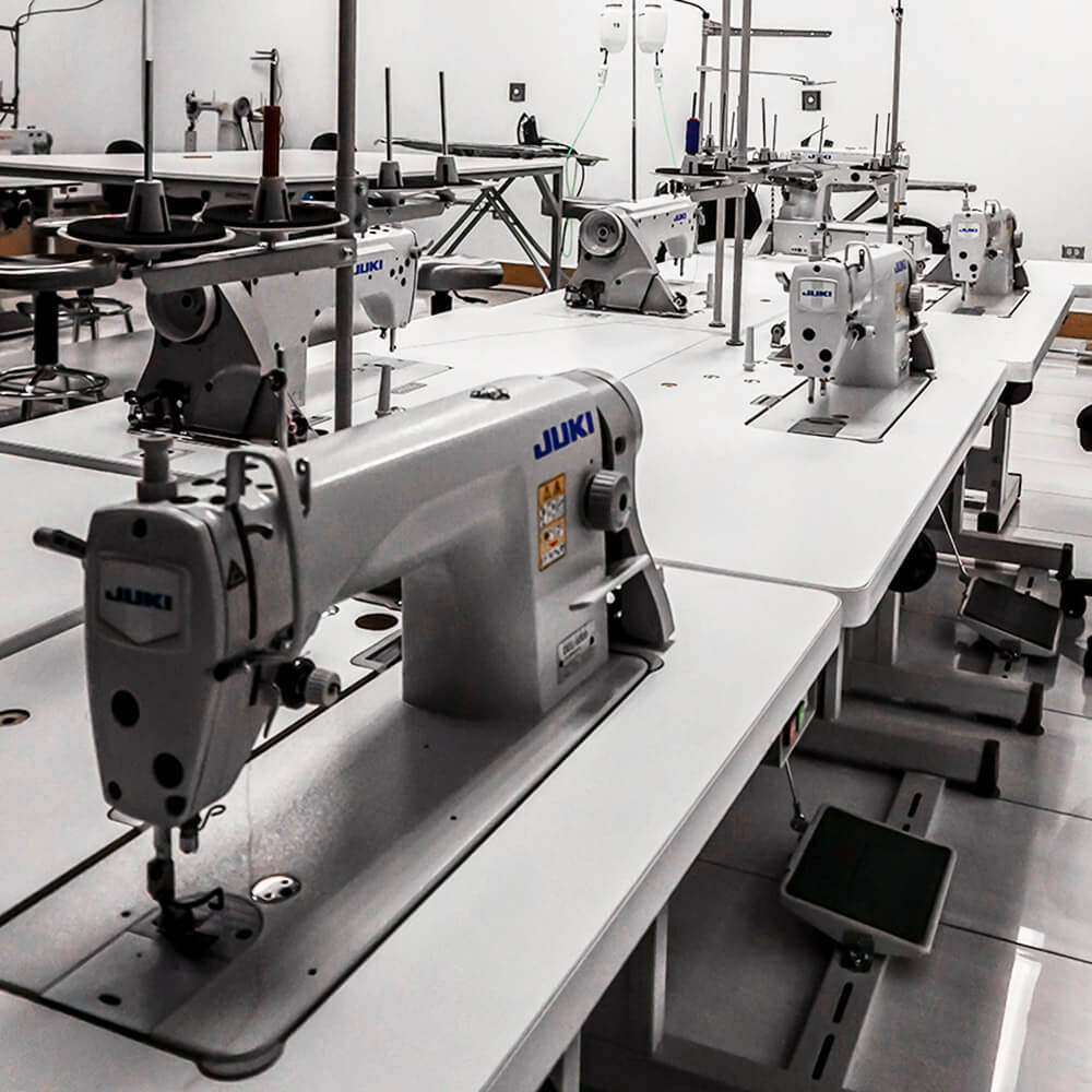 Professional JUKI industrial sewing machines used for high-precision stitching in our custom yoga wear manufacturing facility.