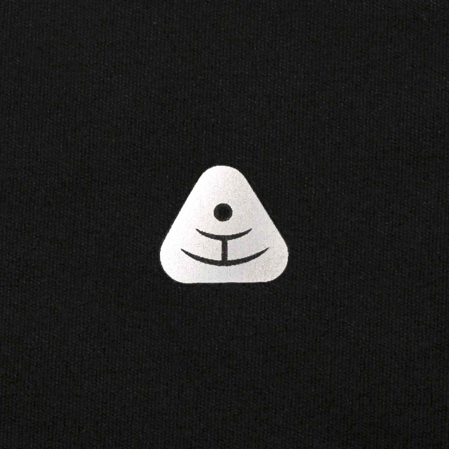 Premium silver TPU laser-cut logo on black yoga pants - Luxury studio branding.