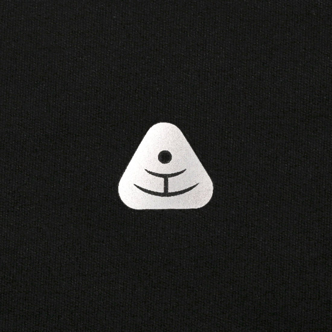Premium silver TPU laser-cut logo on black yoga pants - Luxury studio branding.