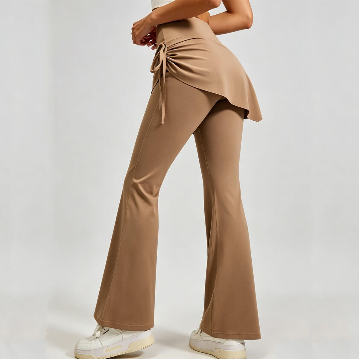 Rear view of 2-in-1 high-waisted skirted flare pants, showcasing the flowy skirt overlay for modest hip coverage and flattering fit.