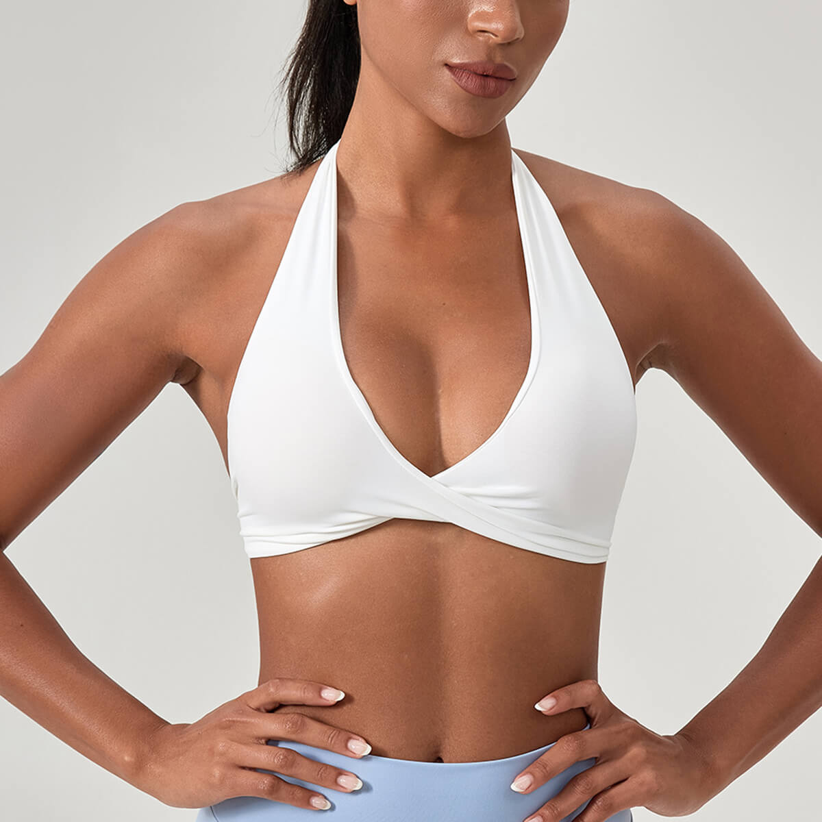 White backless halter yoga bra for women, perfect for low-impact exercise and summer athleisure style