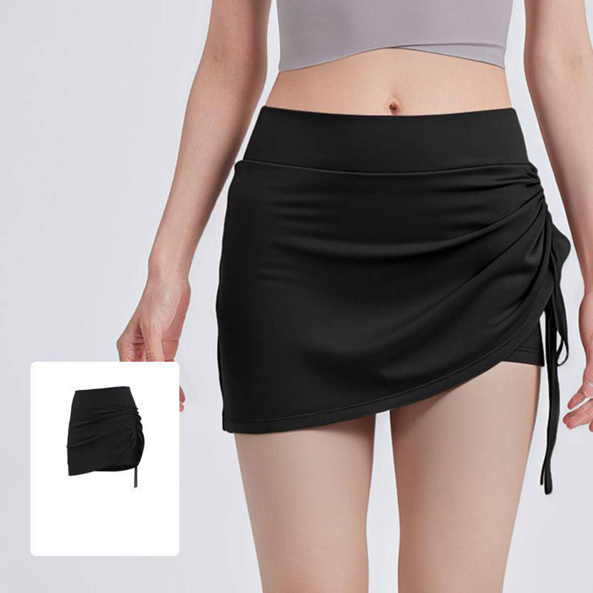 Classic black high-waisted ruched pickleball skirt for women with built-in compression shorts for gym and running.