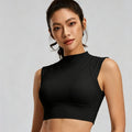 Front view of a woman wearing a black mock neck sports bra with a sleeveless athletic crop top design for yoga and running