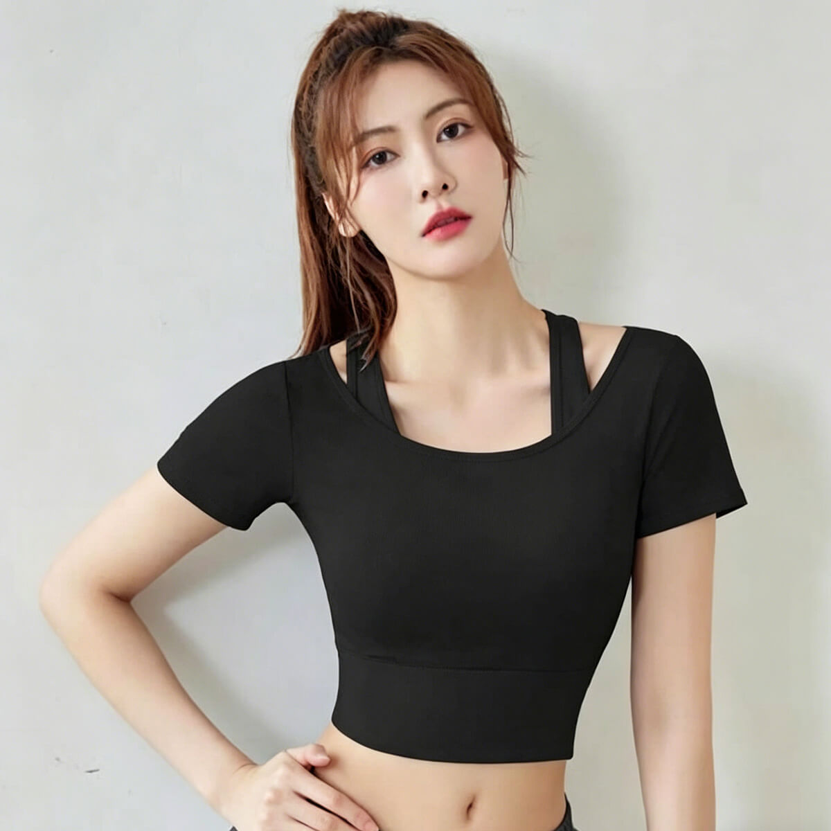Classic black short sleeve yoga crop top for women with a flattering slim fit and moisture-wicking mesh fabric.
