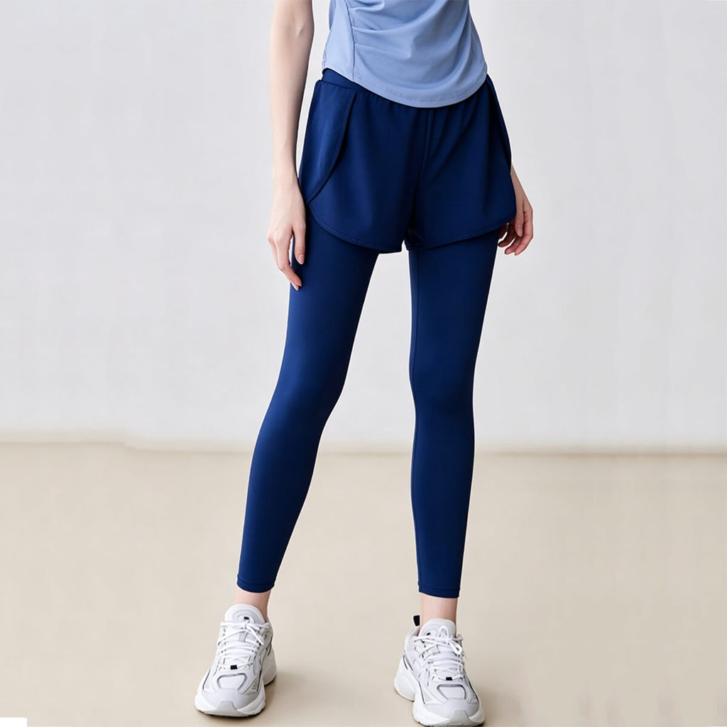 Front view of blue 2-in-1 sports leggings featuring loose outer shorts over slim-fit inner tights for running and gym