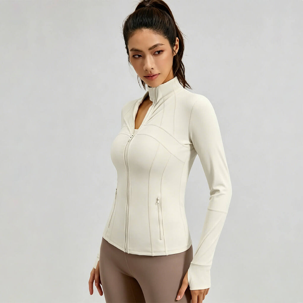 Side view of a breathable white fitness jacket showing sleek design and stretchy activewear fabric.
