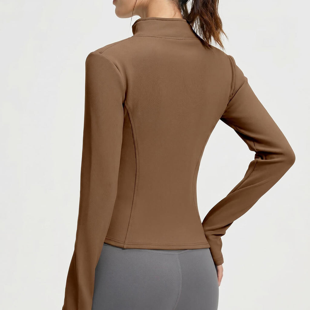 Back view of the brown thermal yoga jacket showing the flattering contour seams and slim-fit silhouette for active women.