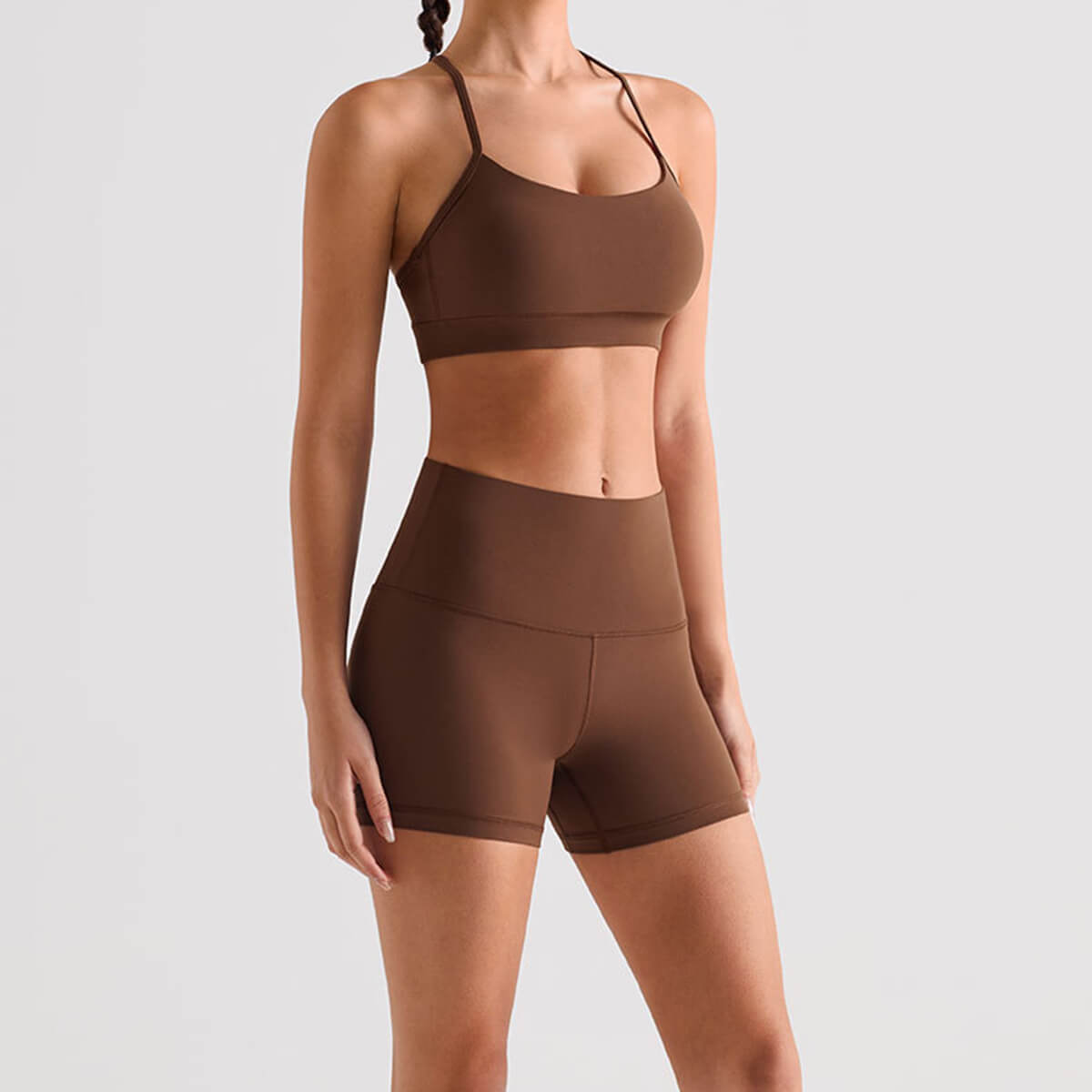 Brown high waisted yoga shorts and matching sports bra set for women.