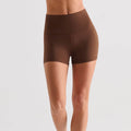 Front view of brown high waisted yoga shorts with tummy control.