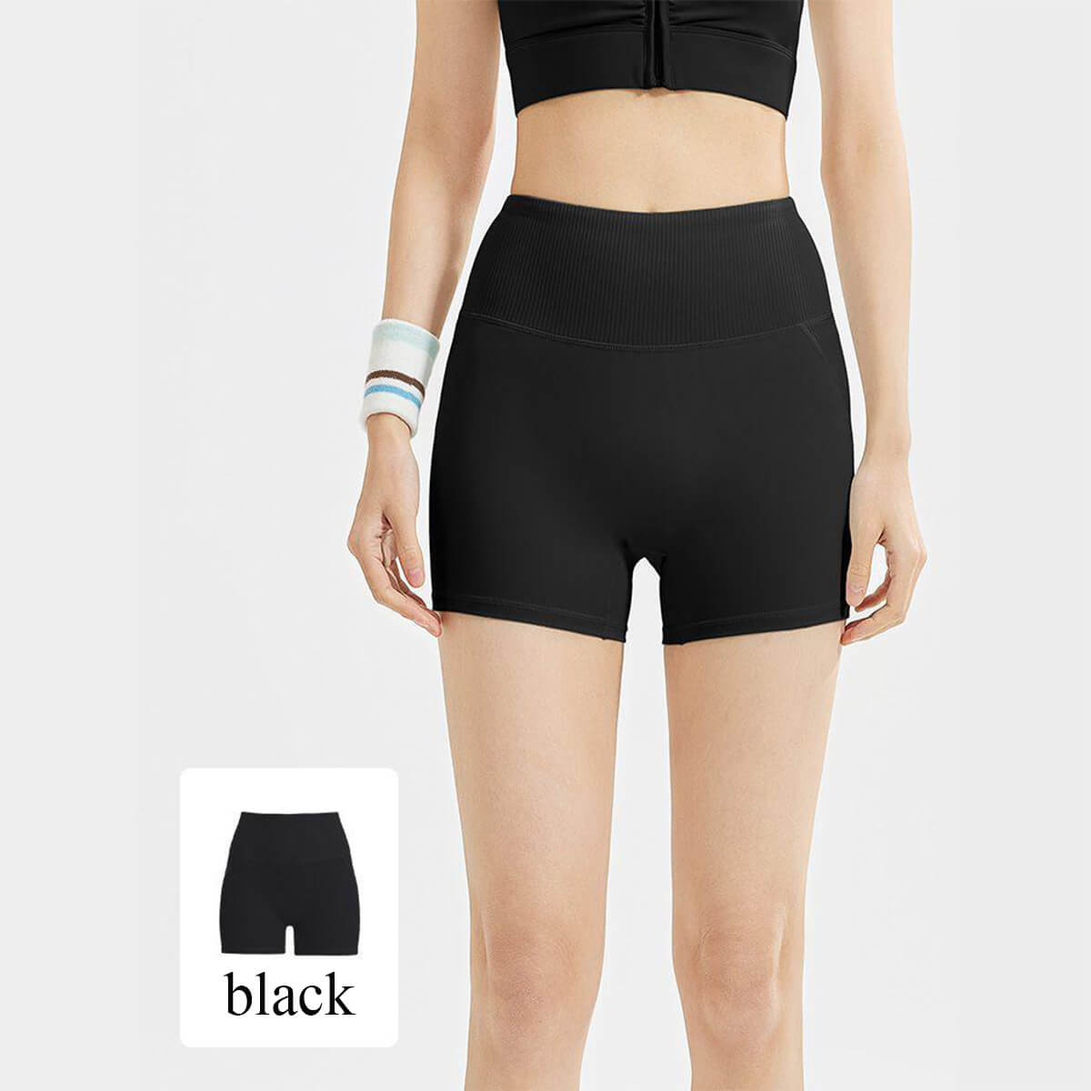 Classic black high-rise yoga shorts with a thick ribbed waistband, versatile for gym sessions, cycling, or casual summer wear.