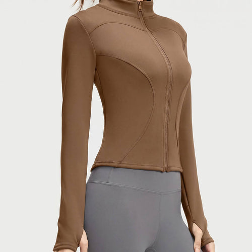 A coffee brown women's athletic zip-up jacket showcasing the functional thumbholes and curved hem for a stylish, sporty look.