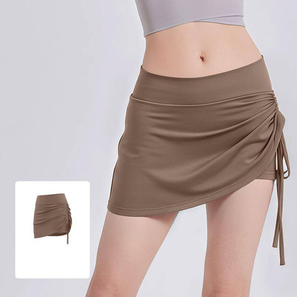 Trendy coffee brown cross-over athletic skort with side drawstring, perfect for golf, tennis, and summer athleisure.