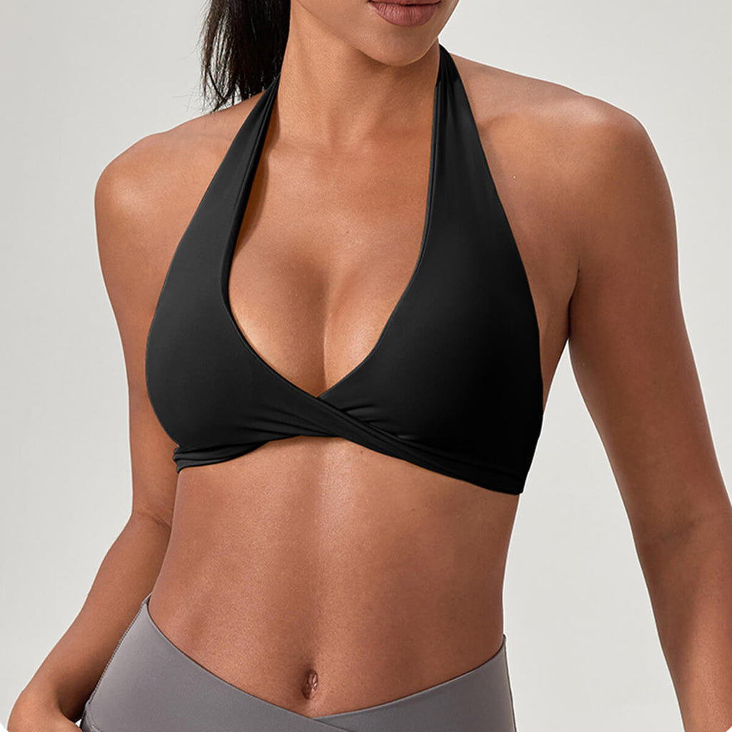 A black criss-cross halter neck workout bra featuring a flattering front twist and supportive athletic fit