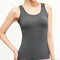 Close-up front view of a women's dark gray yoga tank top featuring a supportive built-in shelf bra and a flattering scoop neckline