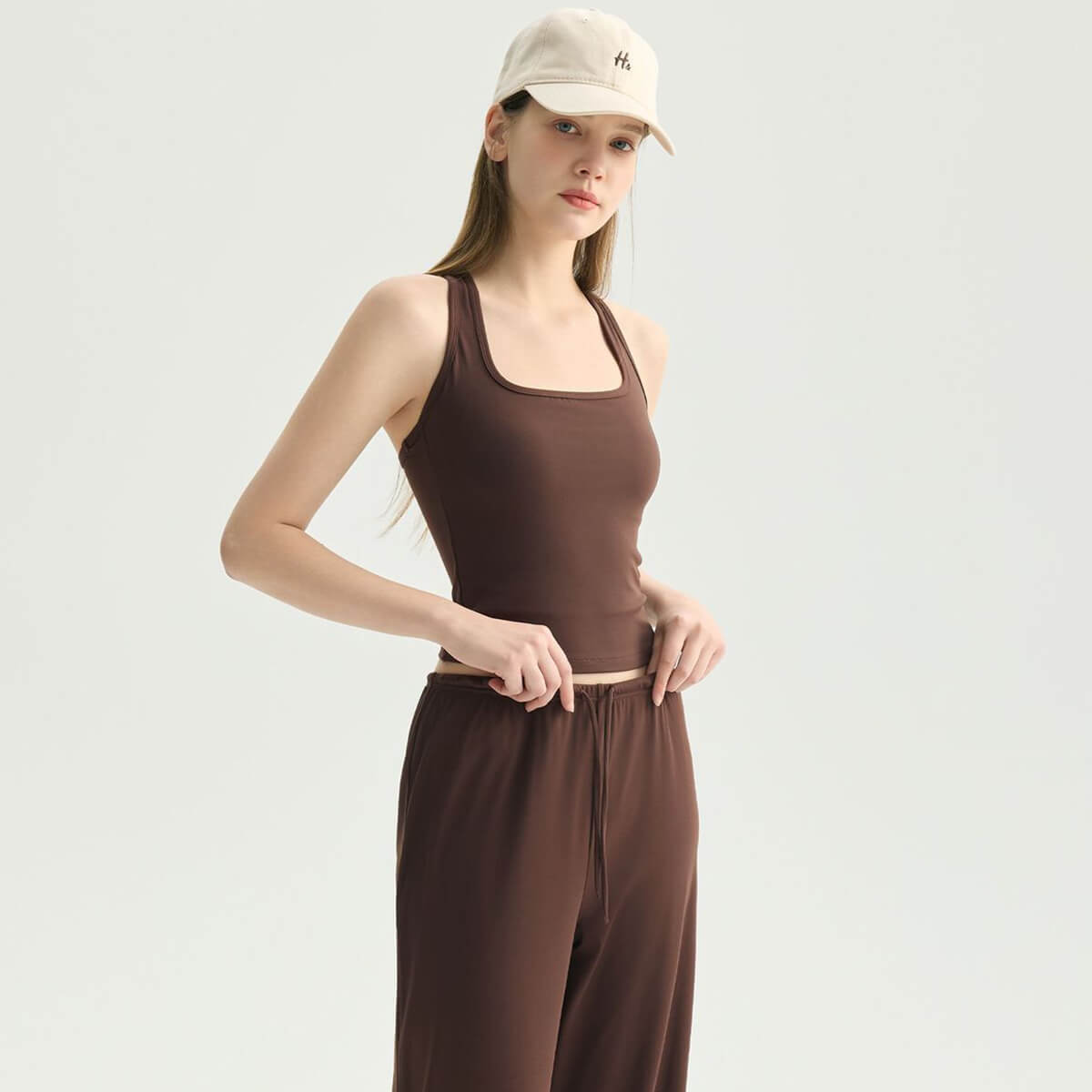 Side view of an espresso brown yoga tank top made from buttery-soft performance fabric.