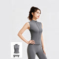 Women's charcoal grey slim fit athletic vest, ideal for gym workouts, tennis, or golf, featuring a smooth zipper closure.