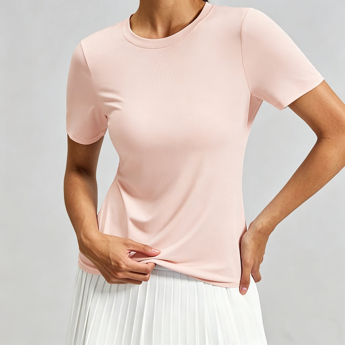Light pink breathable running shirt for women, highlighting the ultra-soft stretch fabric and premium moisture-wicking performance.