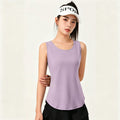 Full length view of a light purple sleeveless yoga top featuring a feminine silhouette and lightweight fabric