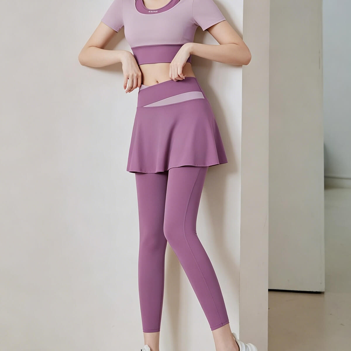 Lilac purple skirted yoga leggings with a feminine sporty design, made from high-stretch breathable fabric suitable for running and outdoor activities