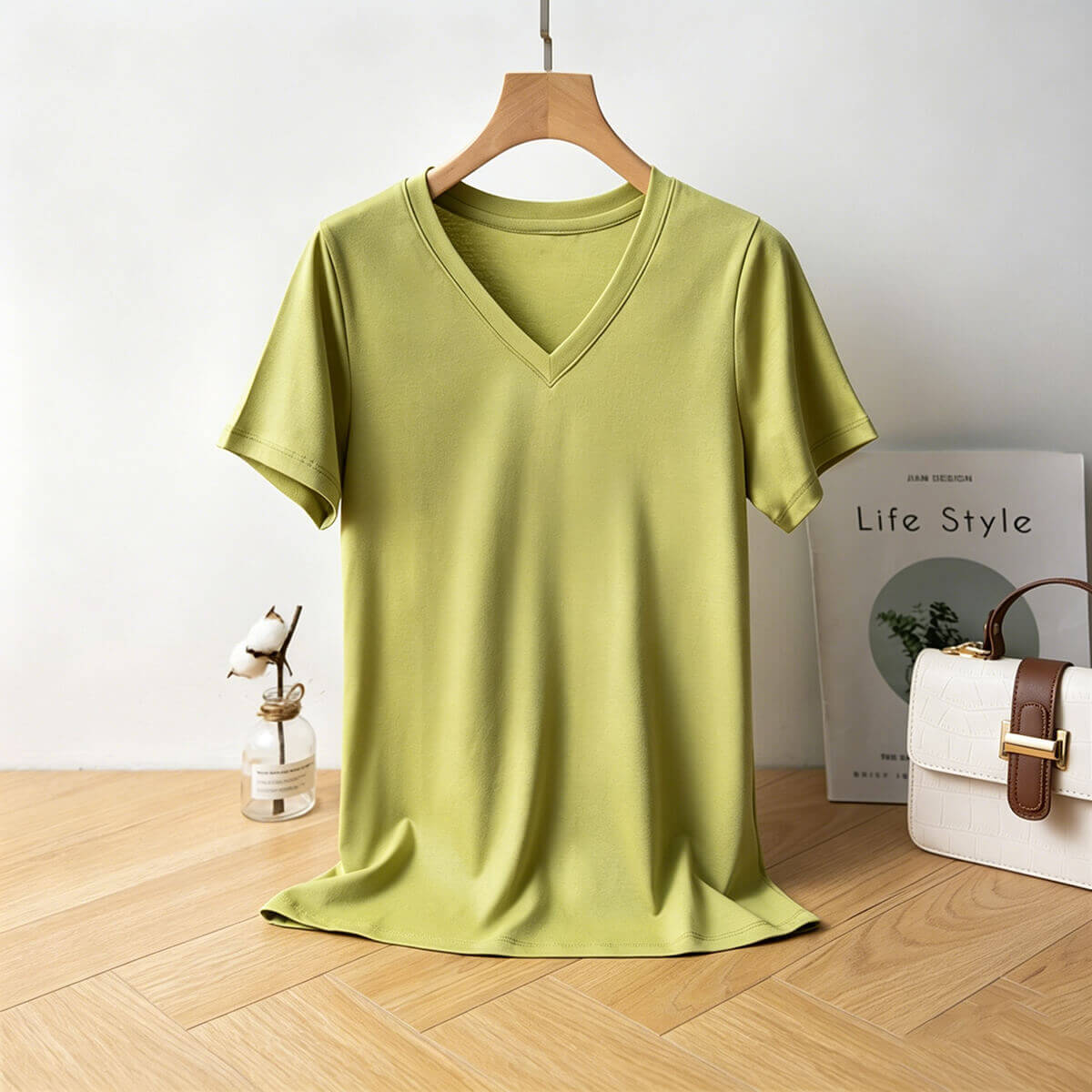 Lime green breathable V-neck T-shirt styled with accessories, highlighting its vibrant summer color and high-quality fabric.