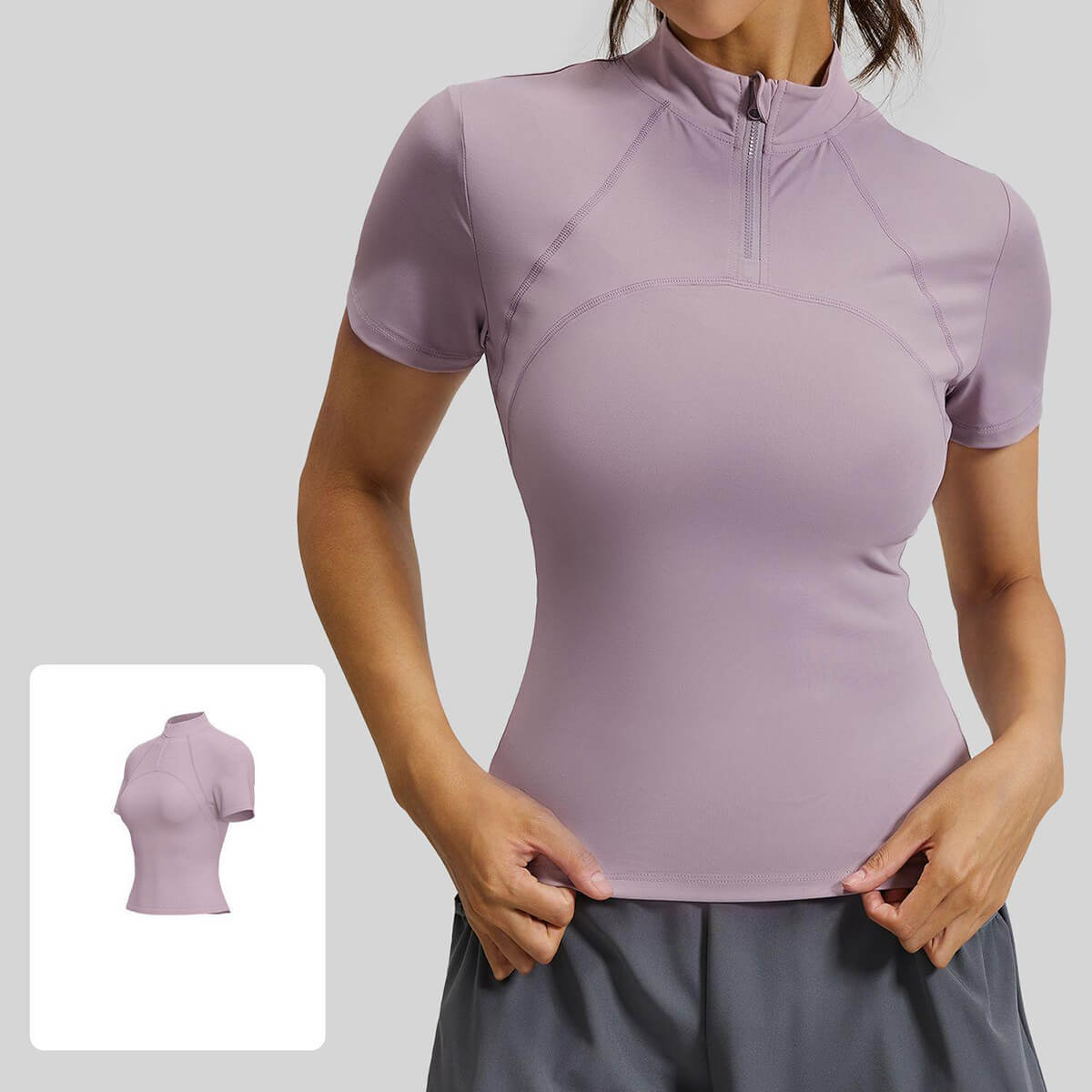 Dusty purple or mauve short sleeve half-zip running shirt for women featuring breathable high-stretch performance fabric.