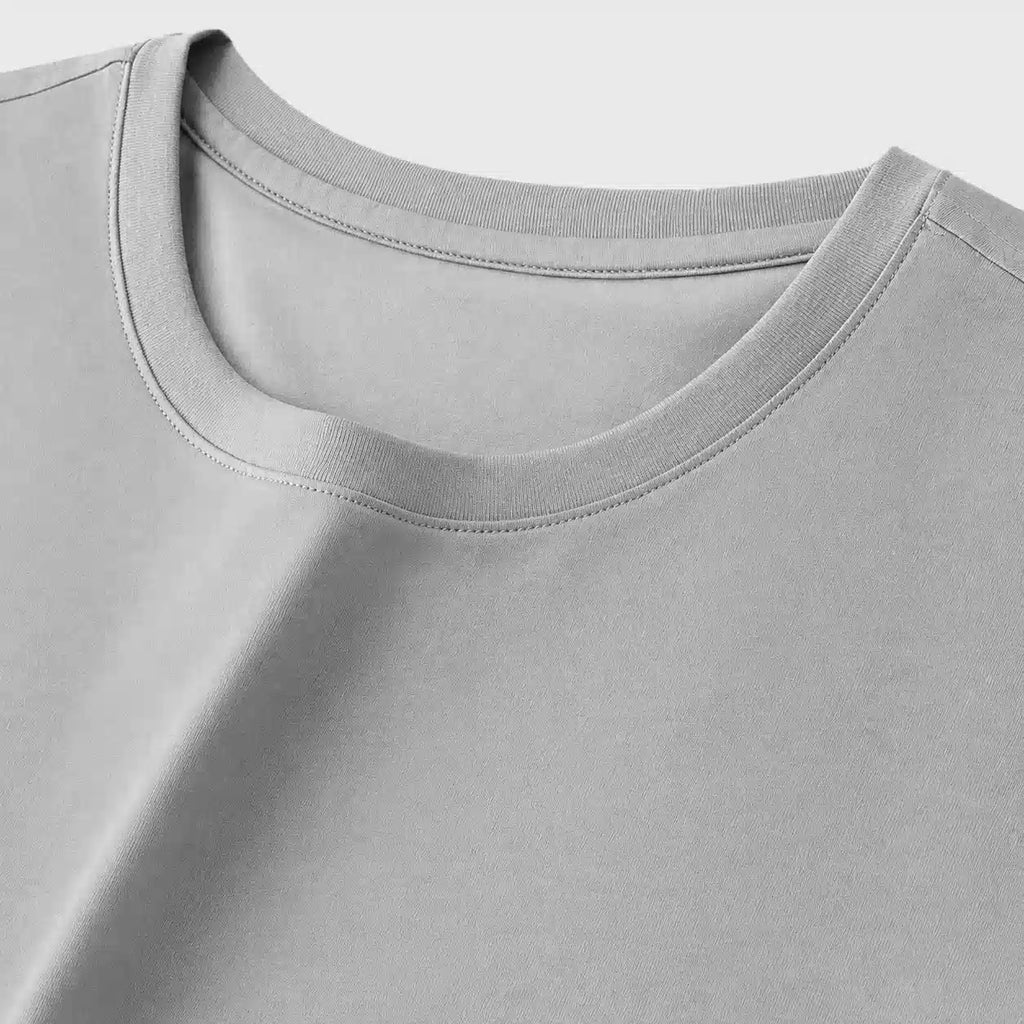 Detail of reinforced ribbed crew neckline on men's short sleeve t-shirt by custom logo clothing manufacturer.
