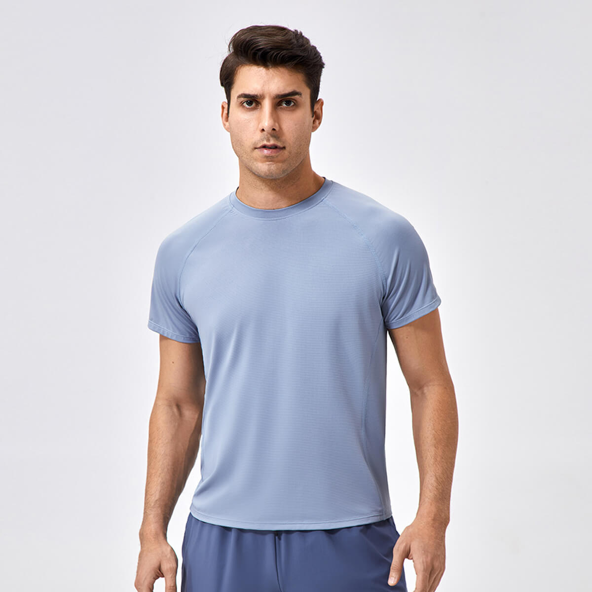 Front view of the men's performance crew neck tee in a stylish slate blue color.