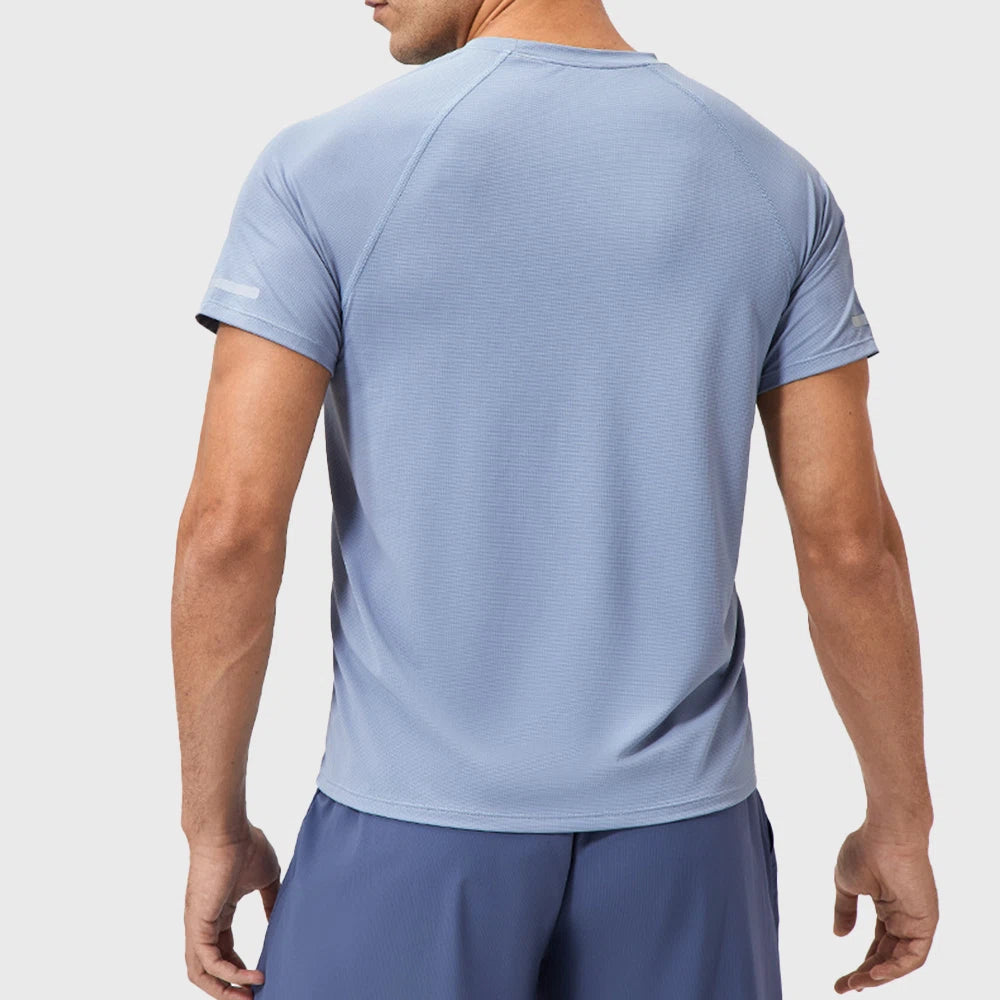 Back view showing reflective stripes on sleeves of men's quick dry running t-shirt in light blue with custom logo, athletic wear manufacturer.
