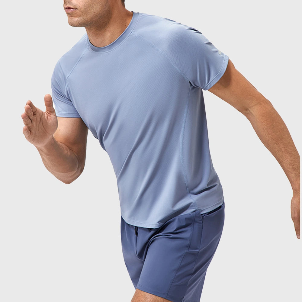 Dynamic running motion view of men's quick dry workout t-shirt in light blue with custom logo, fitness clothing manufacturer.