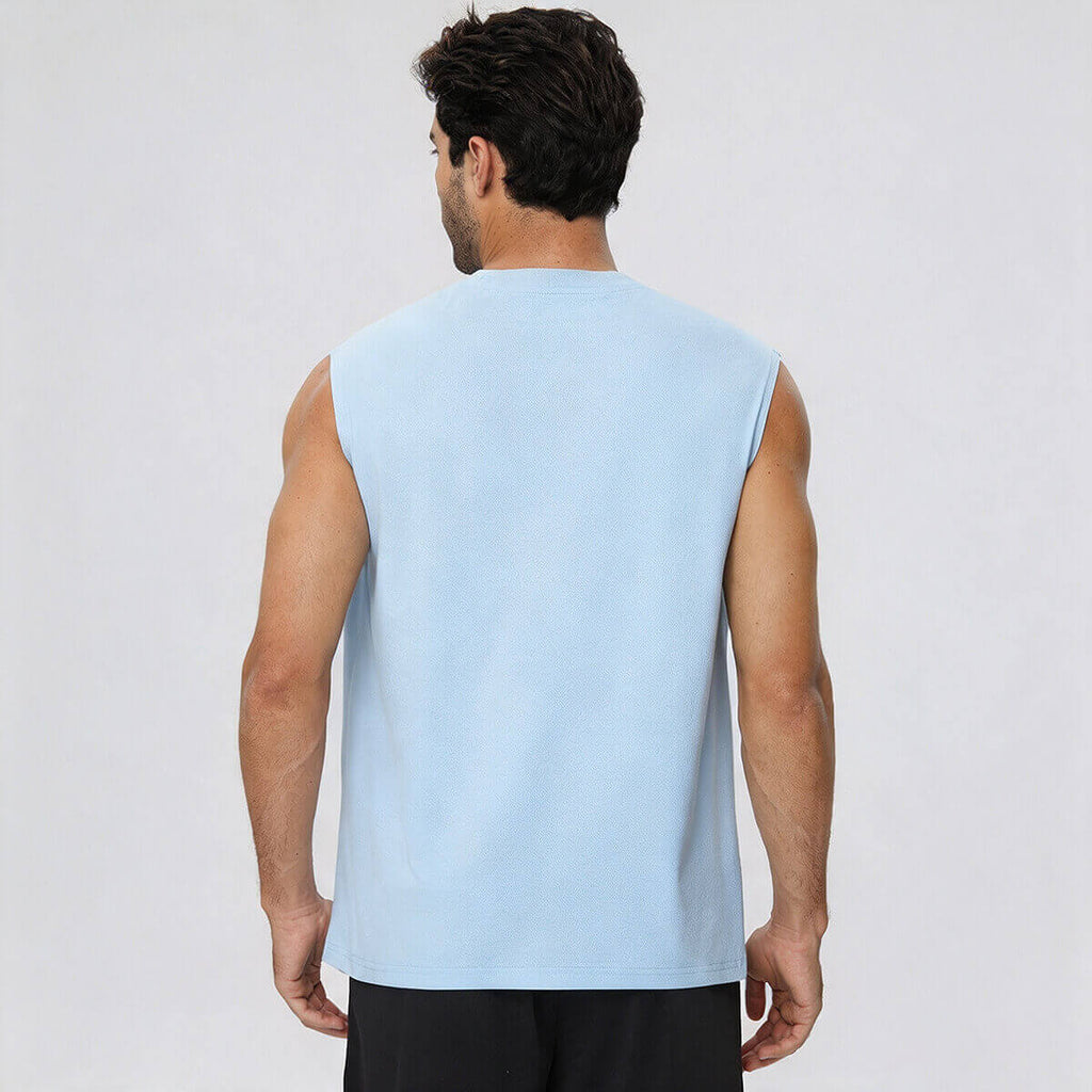 Rear view of a man wearing a light blue sleeveless performance tee, showing the athletic fit.