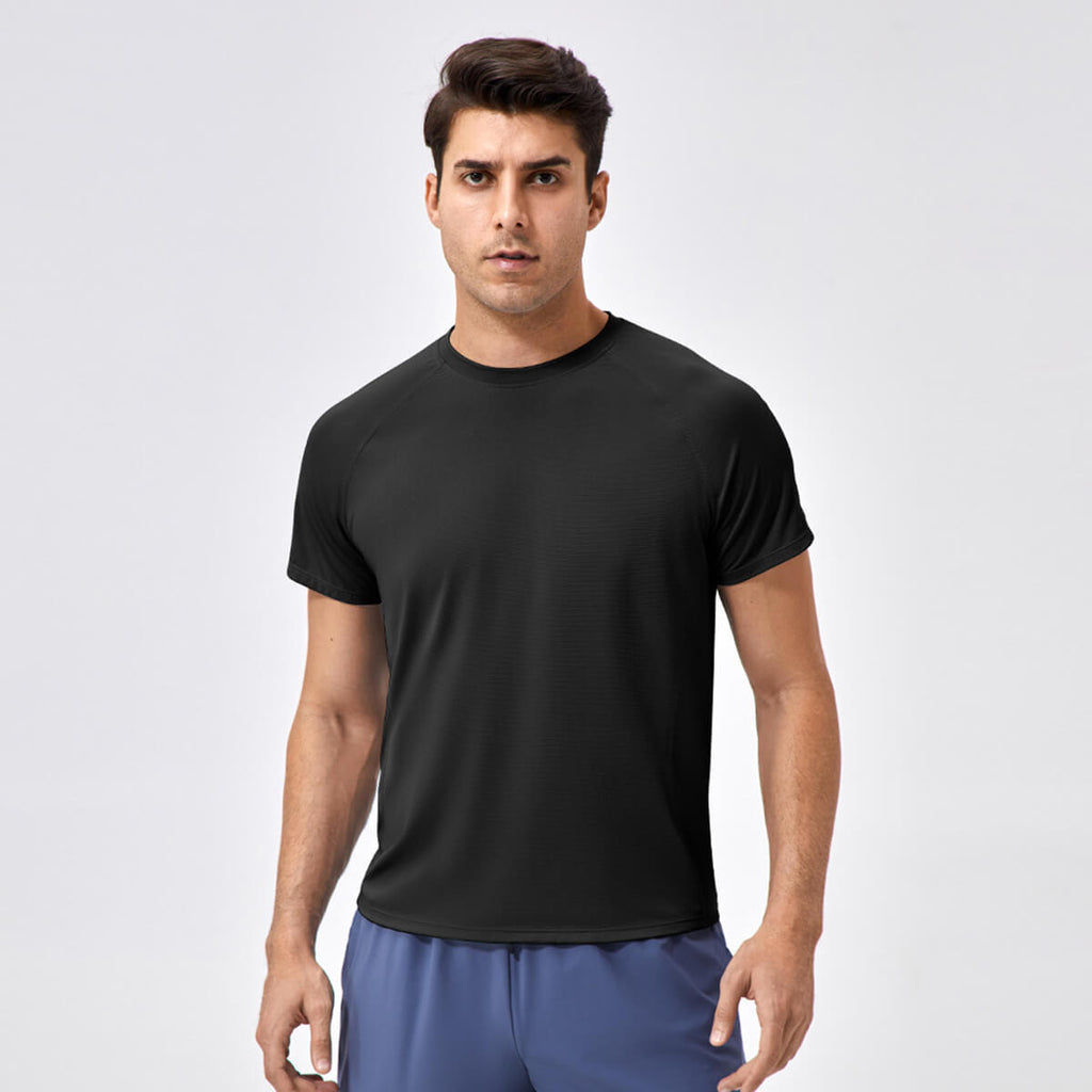 Front view of a man wearing a jet black slim-fit gym shirt designed for high-intensity training.