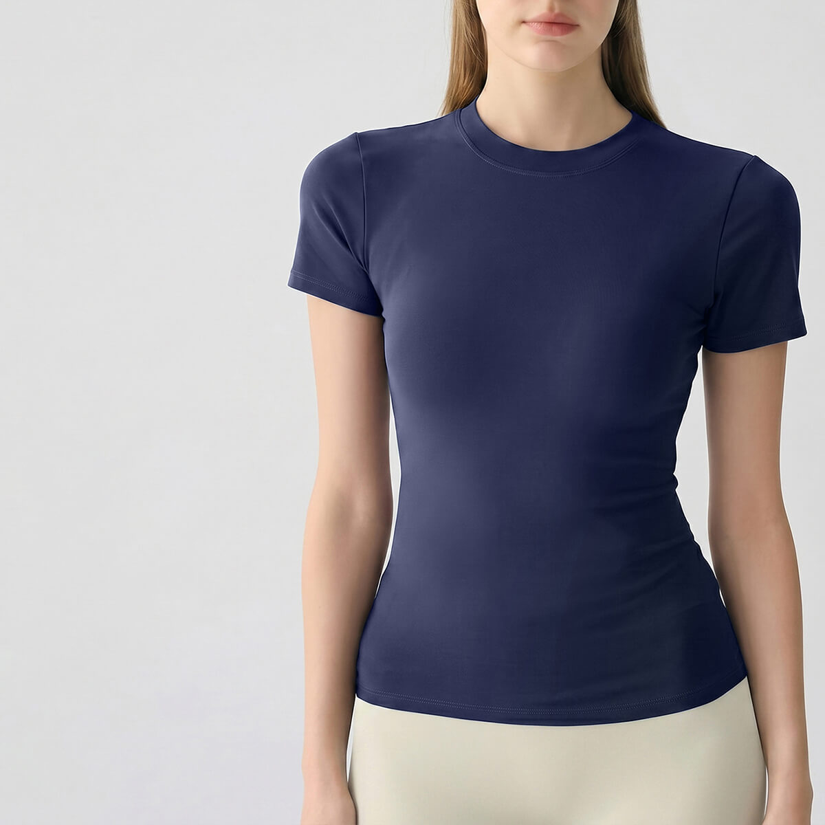A navy blue performance workout top featuring a crew neck and moisture-wicking fabric for gym sessions.