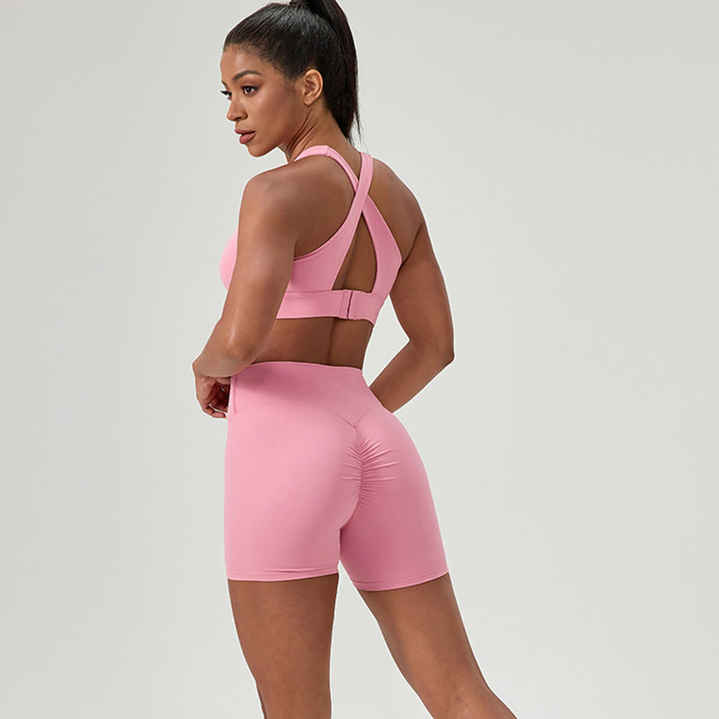 Rear view of pink high-waisted shorts with flattering scrunch butt lifting detail.