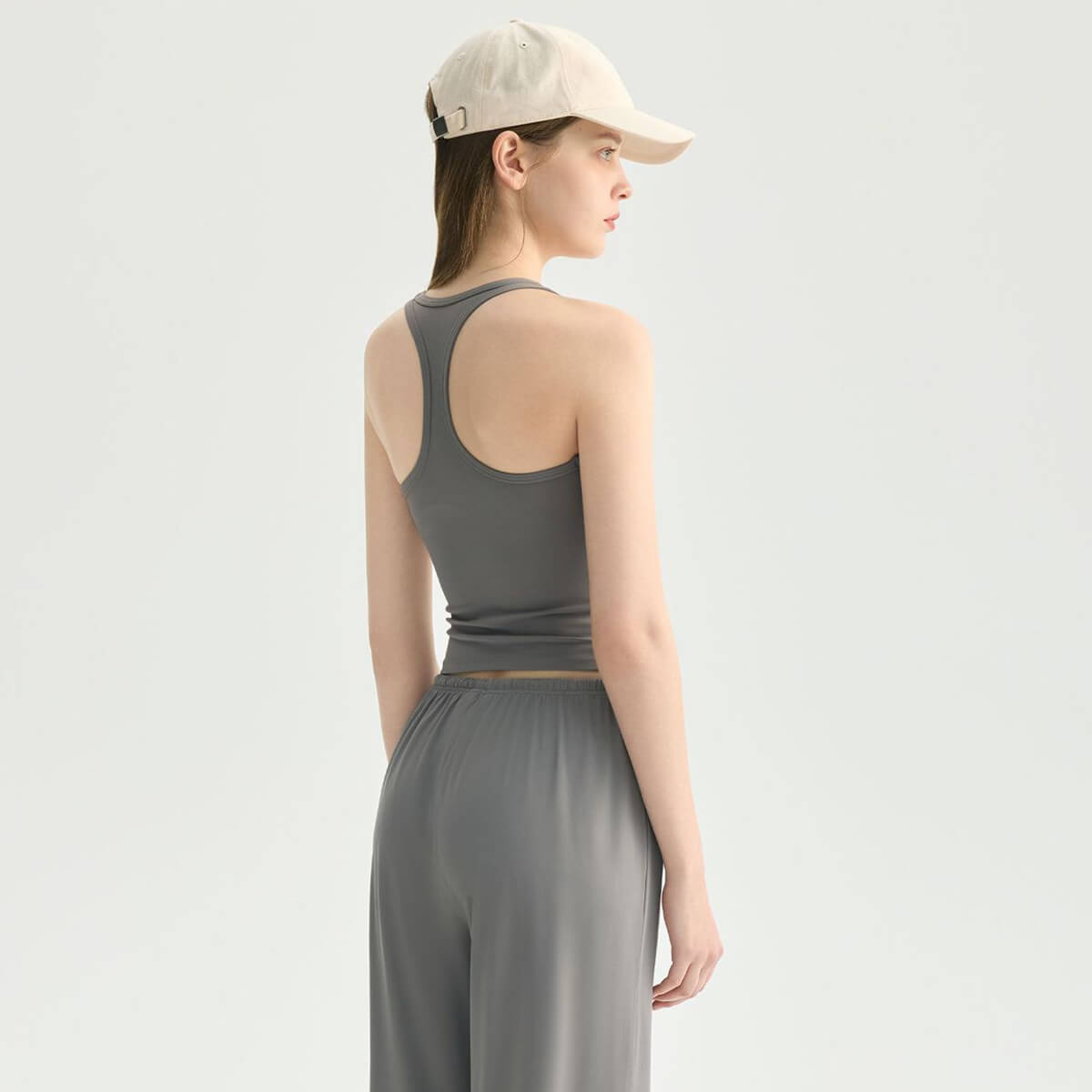 Back view of a gray racerback workout tank top showing the athletic Y-back design.