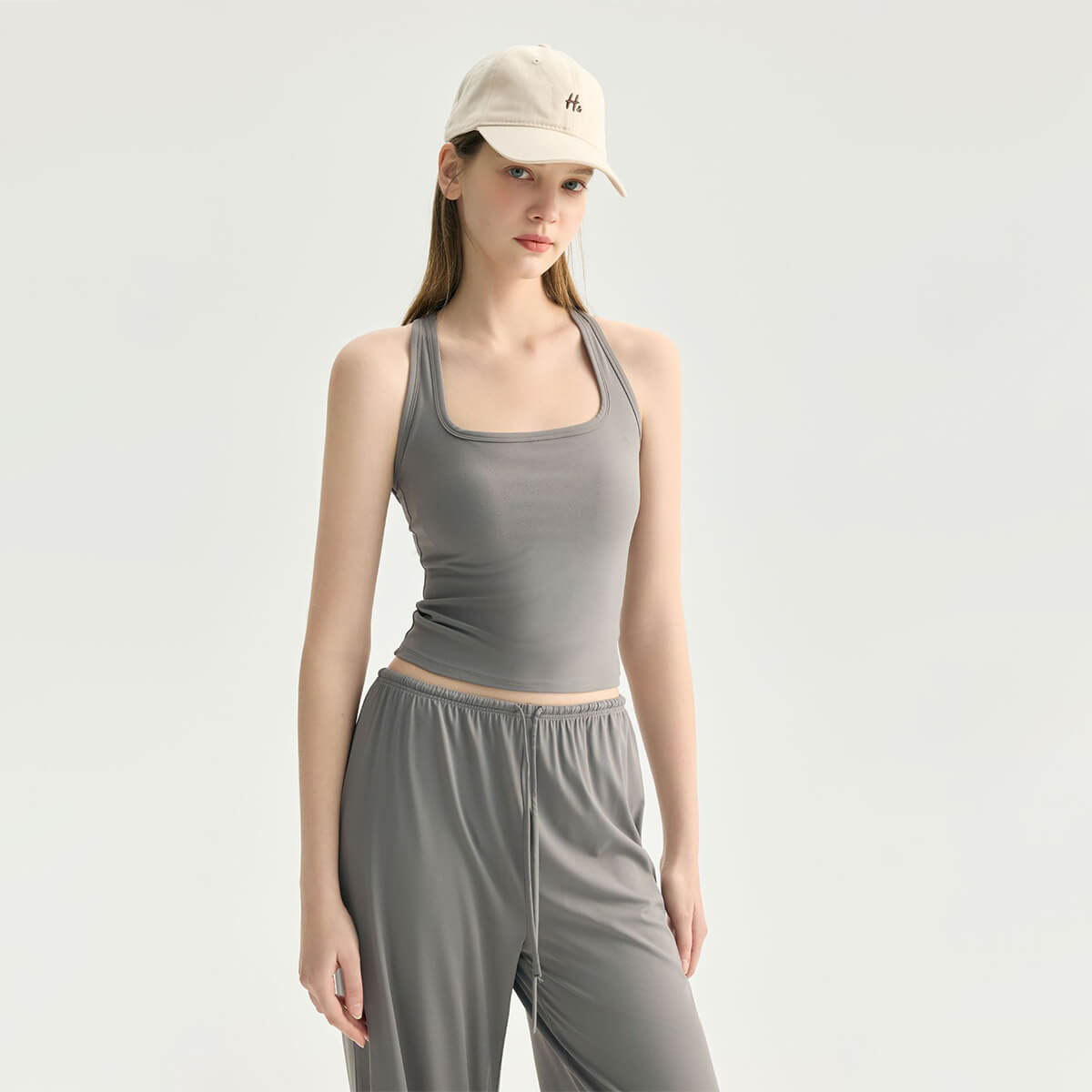 Front view of a slate gray square-neck yoga tank top with a slim-fit design.