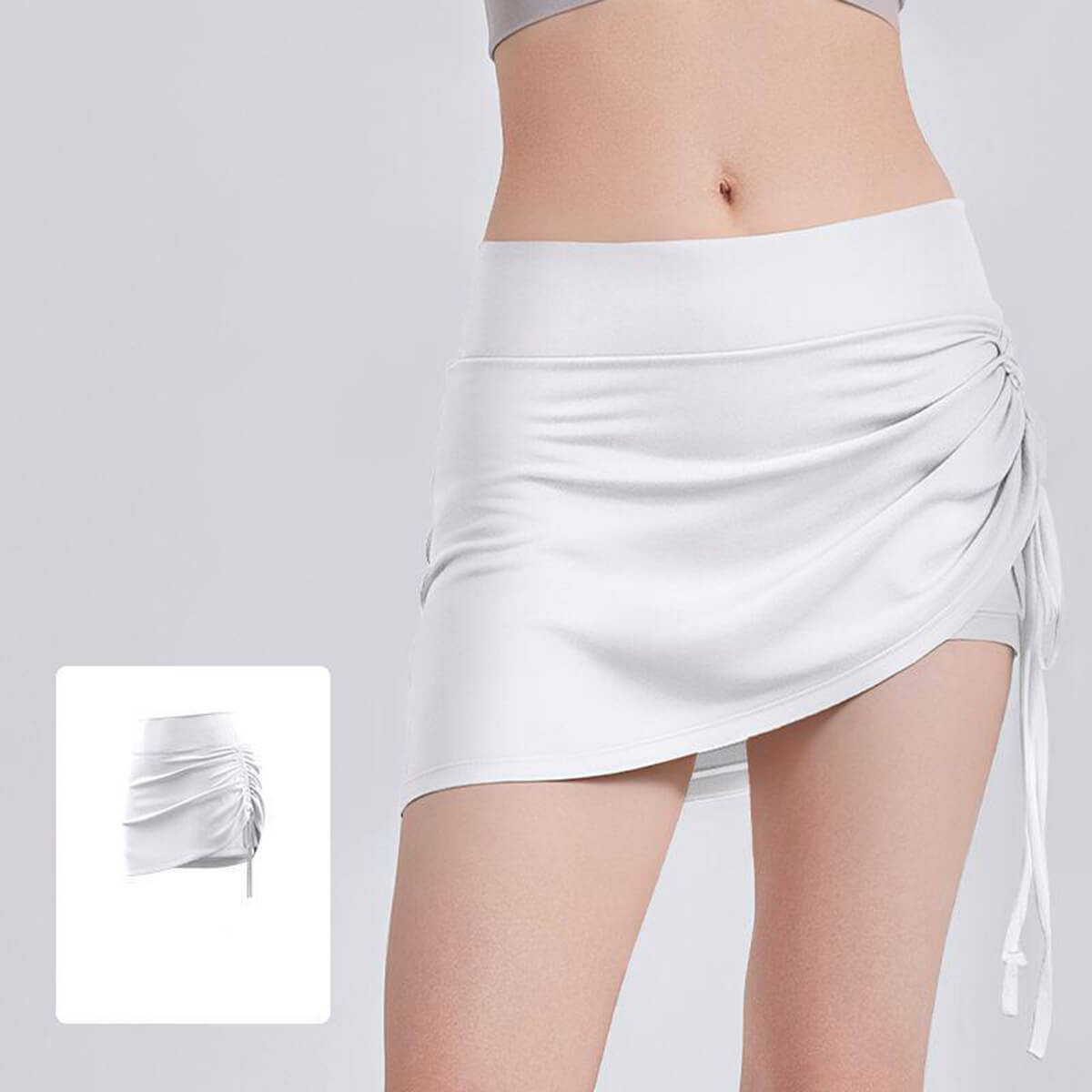 Stylish white side drawstring golf skort for women, made with breathable performance fabric for outdoor sports.