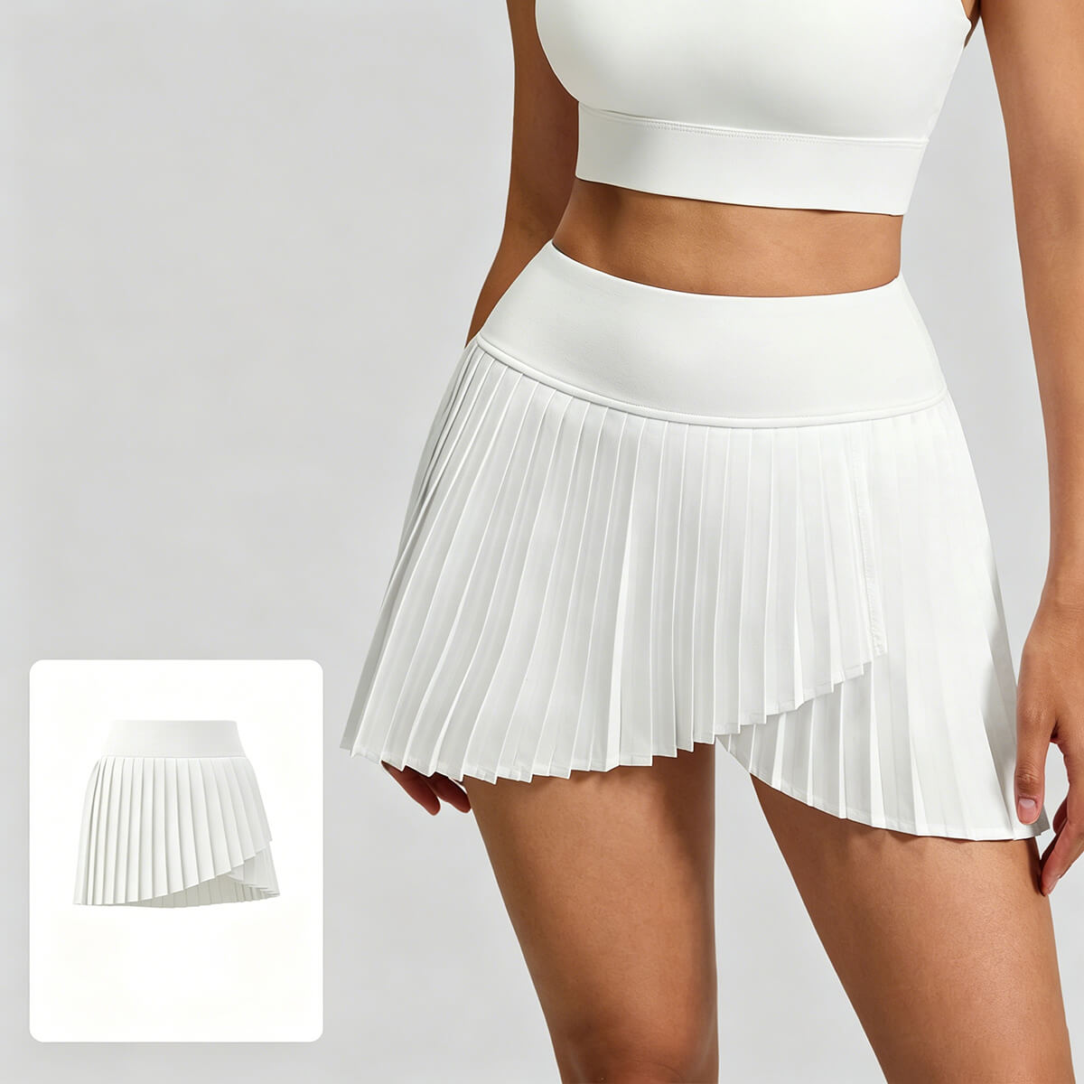 Classic white pleated tennis skirt for wholesale, featuring high-rise fit and moisture-wicking fabric for Pilates and tennis.