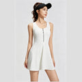 Front view of a white athletic tennis dress for women featuring a front zipper and sleeveless design