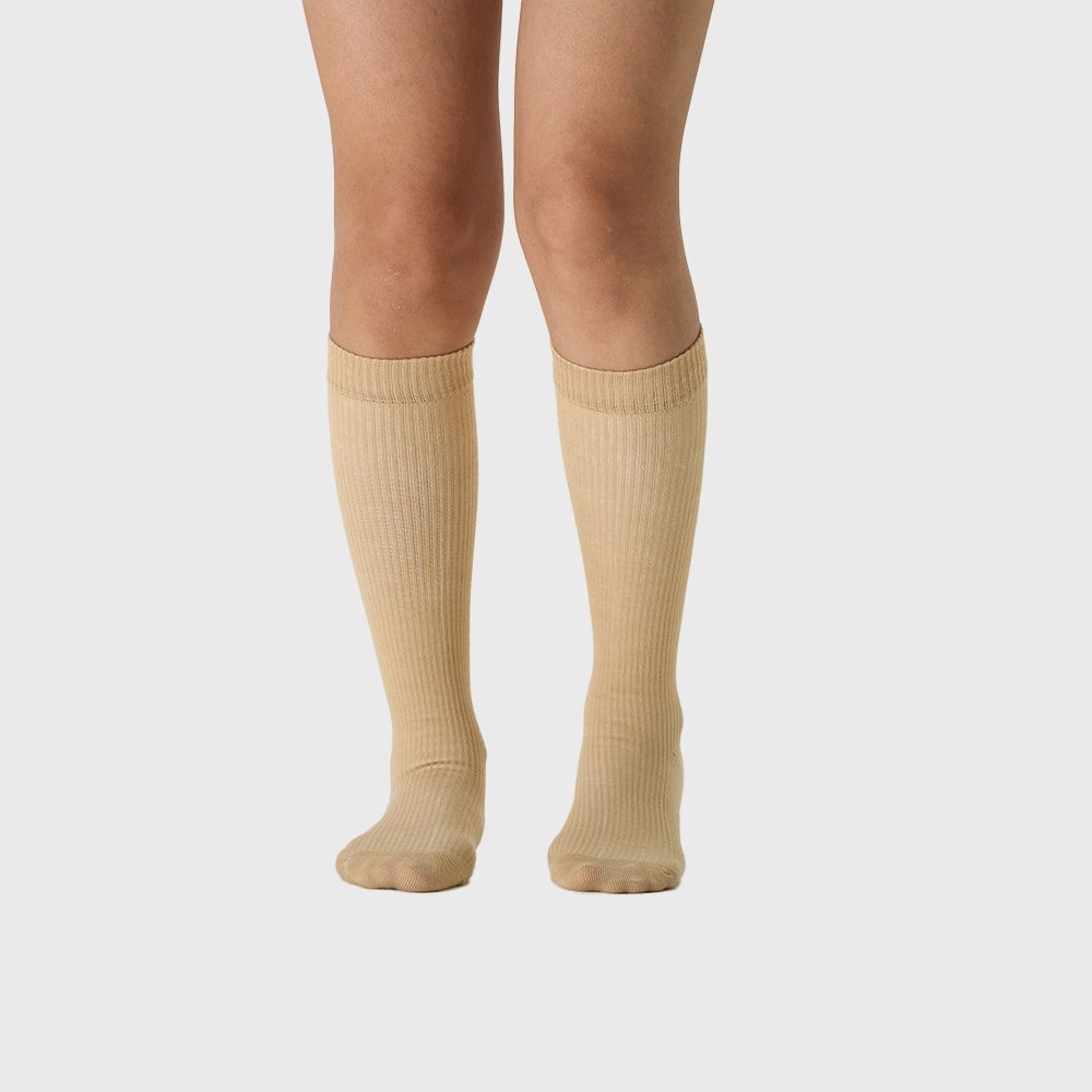Front view of women's 15-20 mmHg knee high support socks in beige with custom logo, OEM gym wear manufacturer.