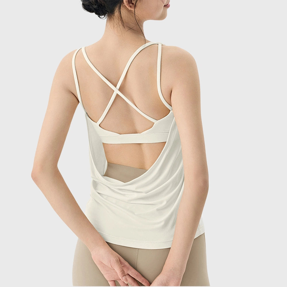 Back view of women's loose cowl back workout tank top with built-in padded bra in cream with custom logo, OEM gym wear manufacturer.

