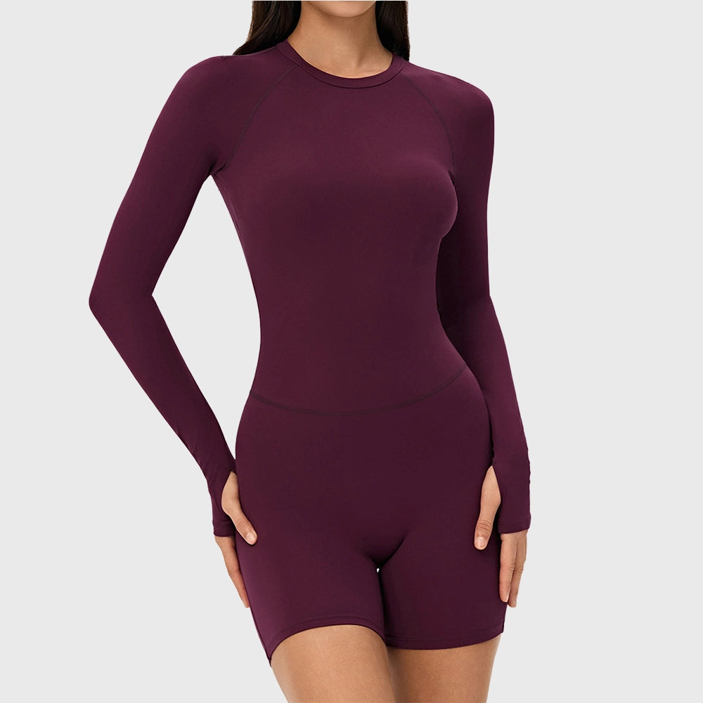 Women's crew neck long sleeve workout romper with thumbholes and removable pads in burgundy with custom logo, direct clothing manufacturer - front view.