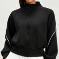 Front view of a women's black cropped athletic bomber jacket with a full-zip front and stand collar, perfect for workout and athleisure.