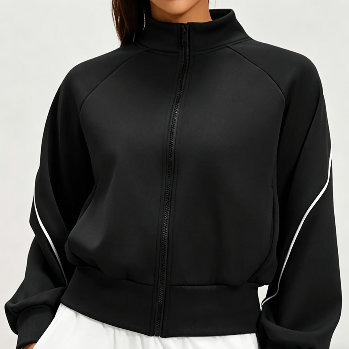 Front view of a women's black cropped athletic bomber jacket with a full-zip front and stand collar, perfect for workout and athleisure.