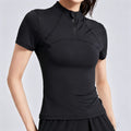 Women's black half-zip workout top with a slim-fit design and contouring seams for a flattering athletic look