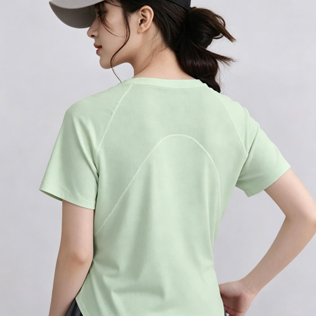Back view of the women's athletic gym top showing the breathable mesh arch design for maximum ventilation during running or yoga.