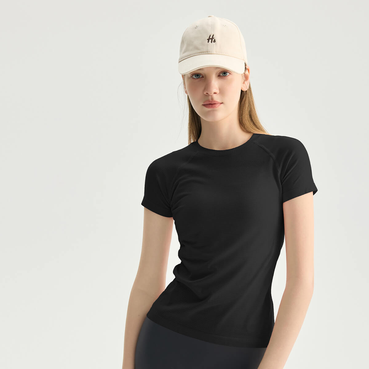 Women's classic black short-sleeve fitness tee, ideal for yoga, running, and training sessions.