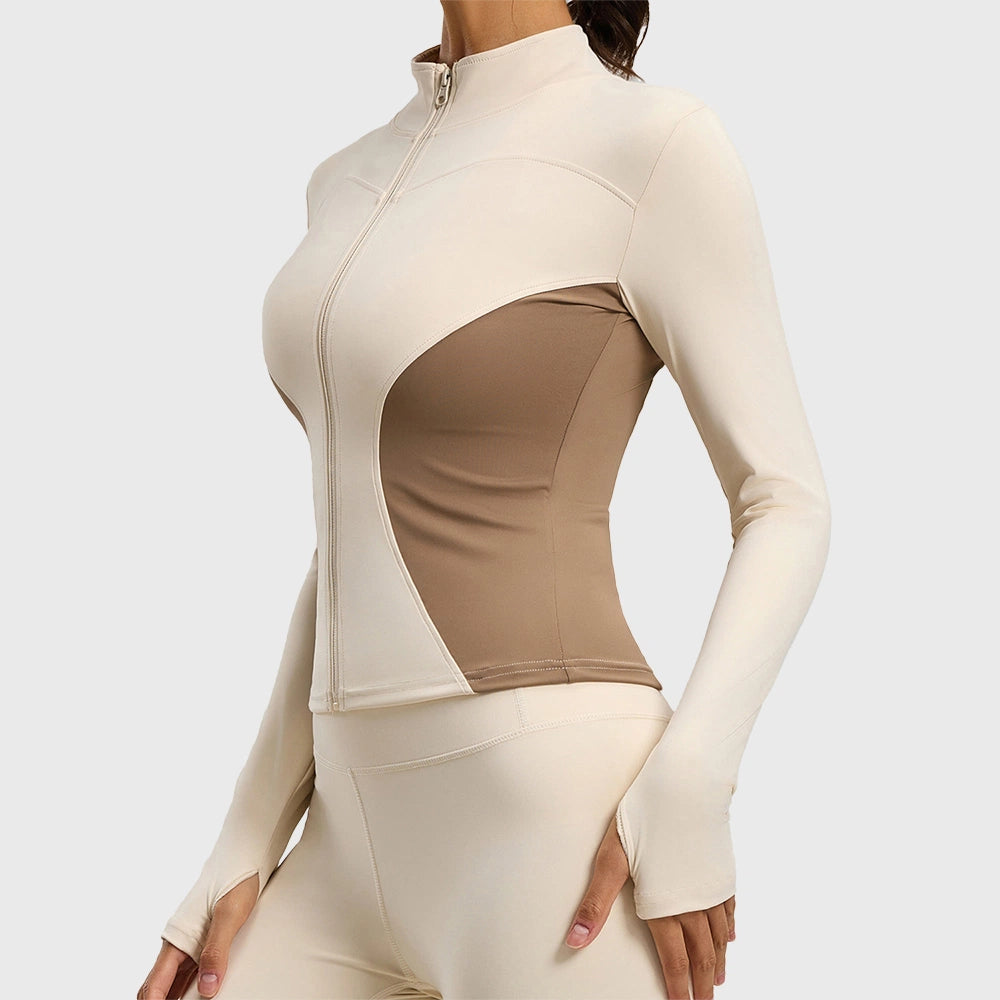 Side profile showing thumbholes on women's contour athletic jacket in cream and brown with custom logo, private label manufacturer.