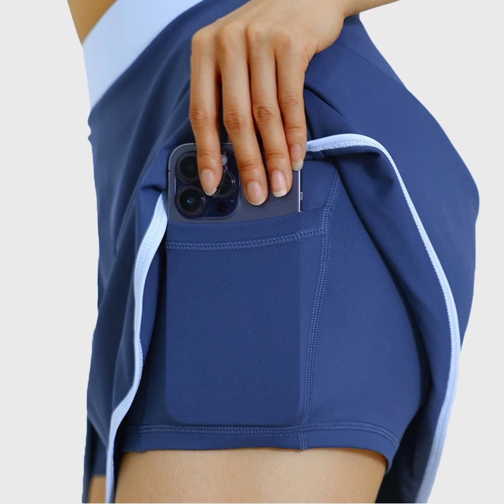 Detail view of built-in shorts with phone pocket on women's tennis skort with custom logo, private label manufacturer.
