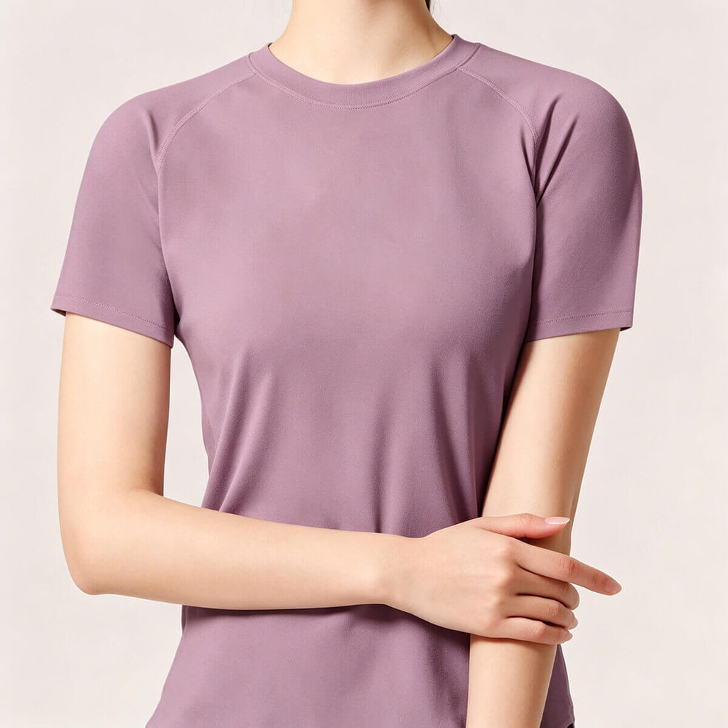Front view of a purple crew neck workout t-shirt for women, designed with high-stretch performance material for a comfortable athletic fit.