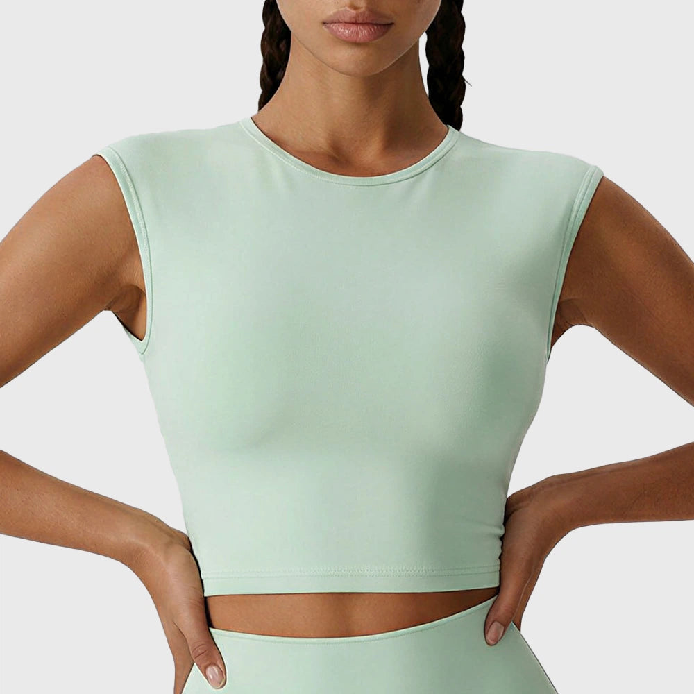 Front look of mint green crewneck cap sleeve fitness crop top ready for custom logo branding, manufactured by activewear manufacturer.